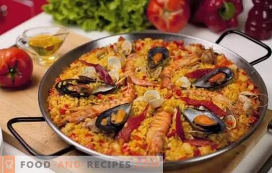 Paella aux fruits de mer - Plov dans le style espagnol. Cuire la paella avec fruits de mer et haricots, maïs, pois, poisson
